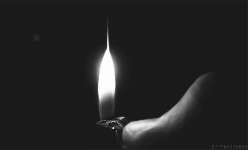 Animated gif in b/w of a thumb lighting a lighter